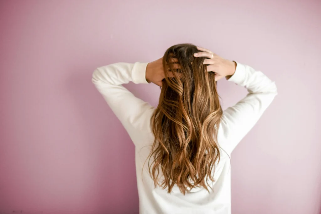 a girl holding the hair